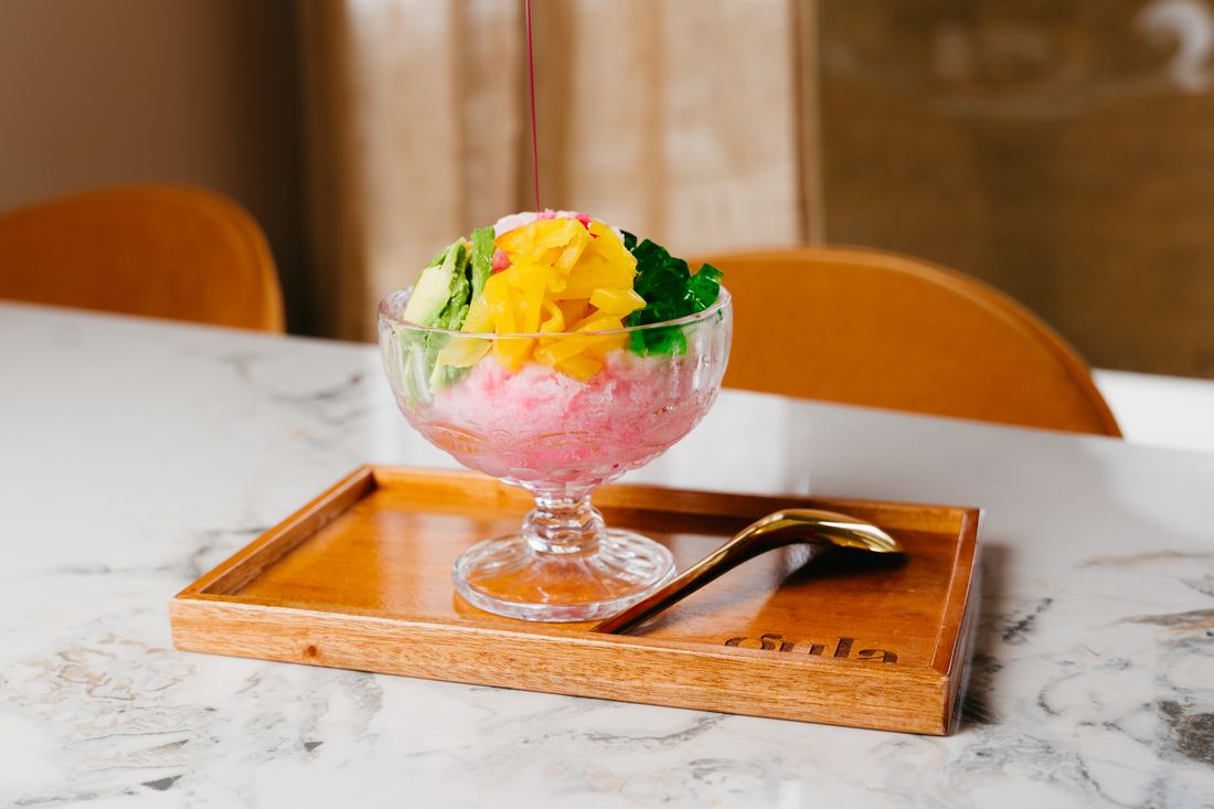 Shaved ice dessert topped with flowers