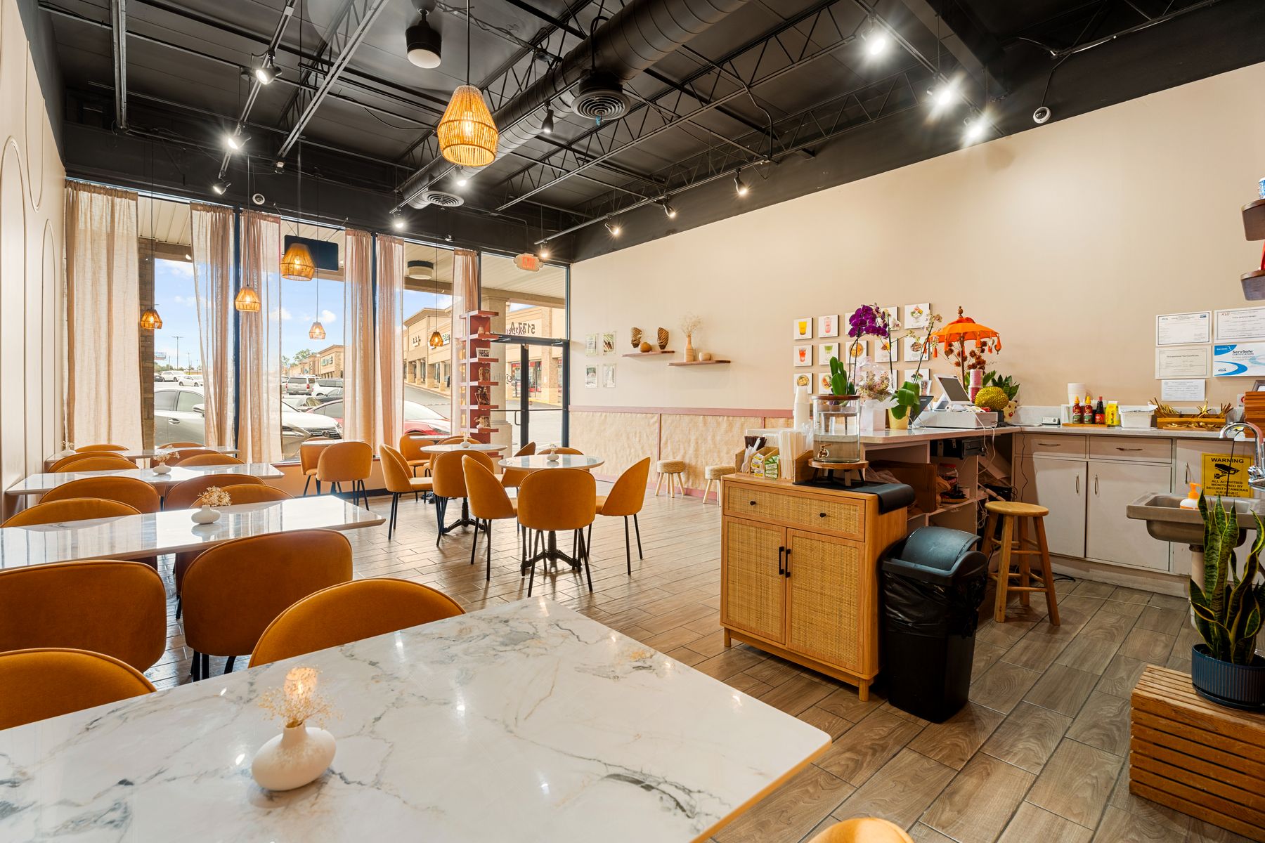 gula's sunlit café interior with terracotta walls and warm wood tables